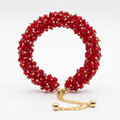 Red beaded bracelet with gold chain