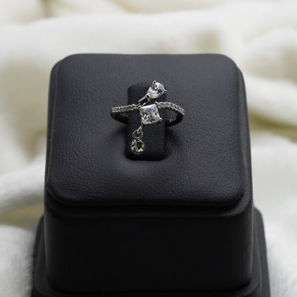 Silver elegant ring with two sparkling stones and dangling